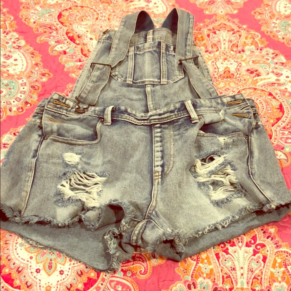 Ripped jean overalls